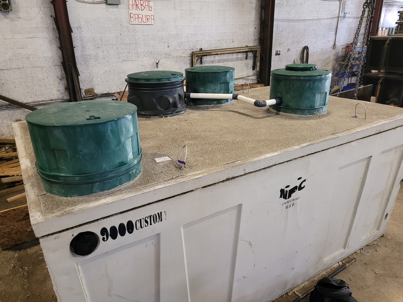 Compact Series concrete tank with green access lids